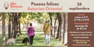 Cartel de la formación, aparecen dos personas junto a sus perros paseando entre árboles